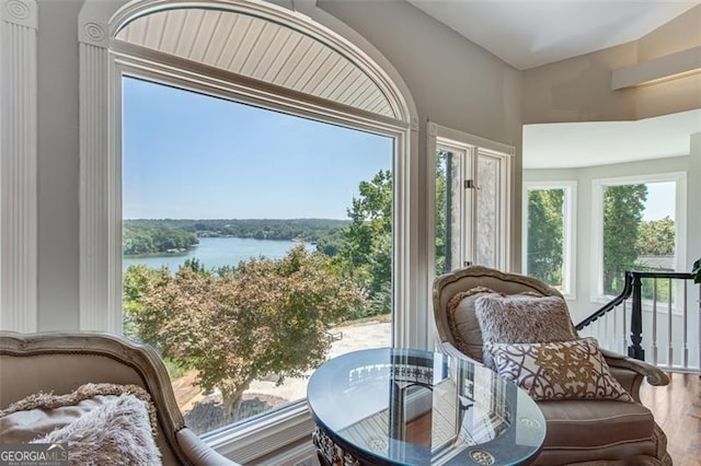 sunroom / solarium with a water view