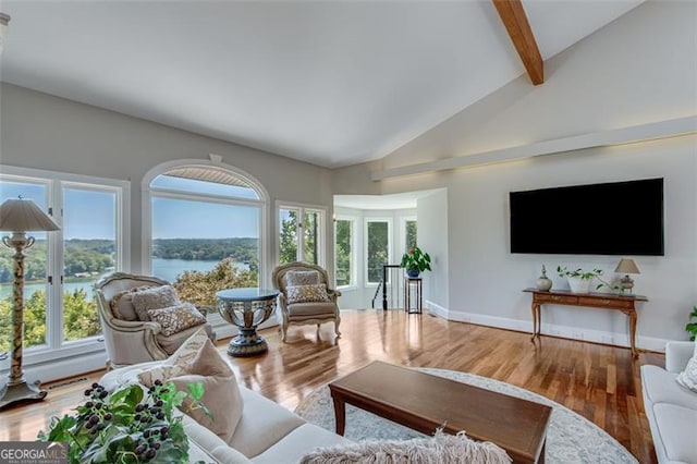 living room featuring beam ceiling, high vaulted ceiling, and wood-type flooring