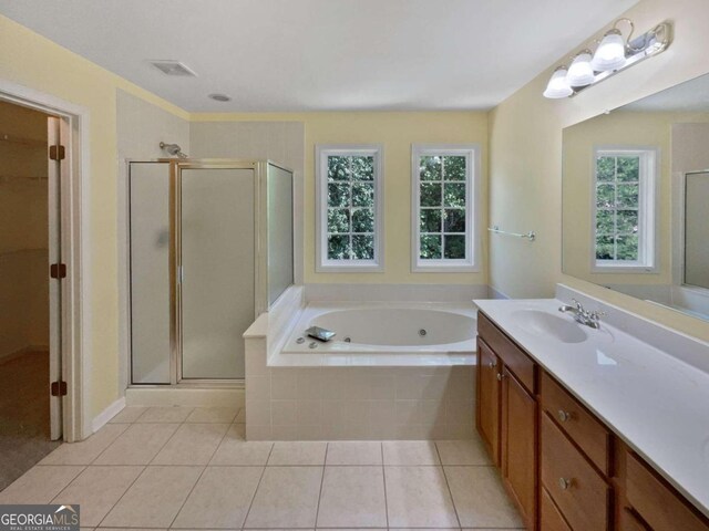 bathroom featuring separate shower and tub, tile patterned flooring, and vanity