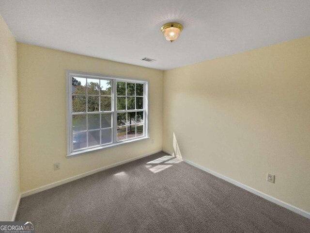 empty room featuring carpet flooring