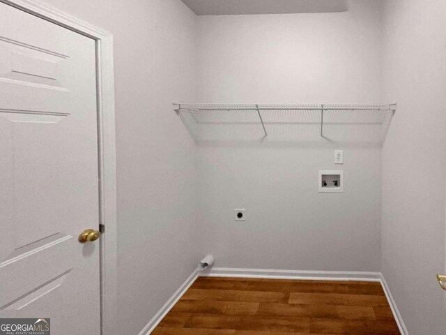 washroom featuring hardwood / wood-style floors, hookup for a washing machine, and electric dryer hookup