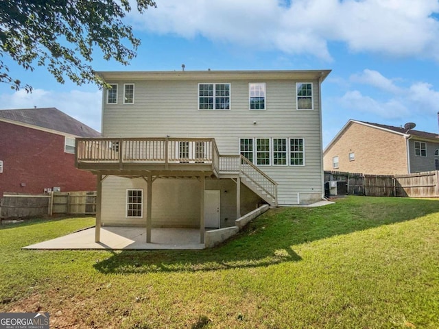 back of house with a wooden deck, central AC, a patio area, and a yard