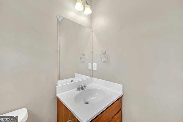 bathroom with vanity and toilet