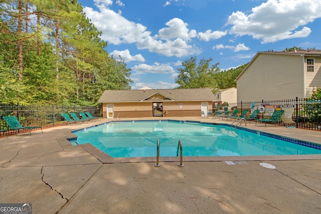 view of swimming pool with a patio