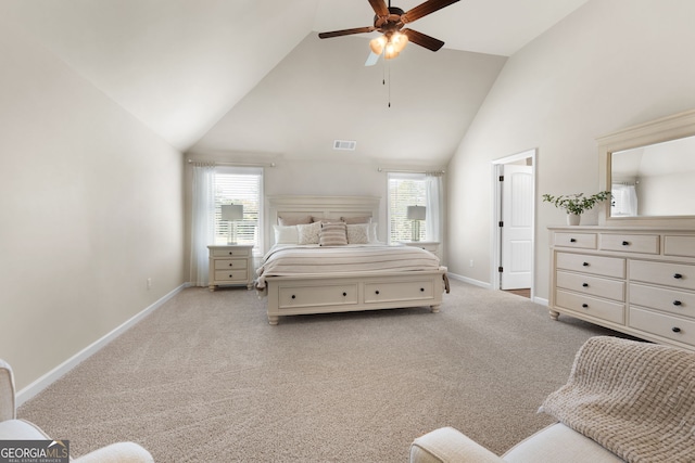 bedroom featuring light colored carpet, multiple windows, and ceiling fan