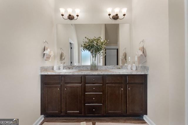 bathroom with vanity and hardwood / wood-style floors