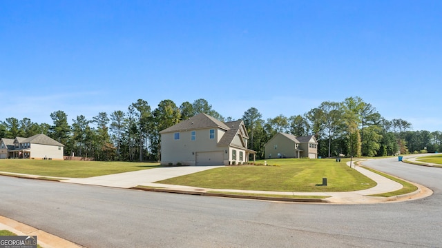 view of front of house featuring a garage and a front yard