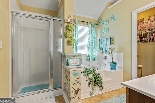 bathroom with vanity, lofted ceiling, a shower with shower door, and tile patterned flooring