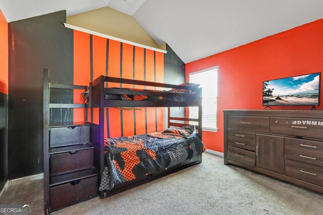 carpeted bedroom featuring vaulted ceiling