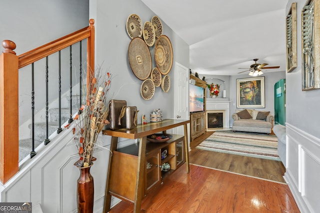 entrance foyer with ceiling fan and hardwood / wood-style floors