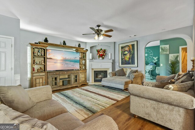 living room with hardwood / wood-style floors and ceiling fan