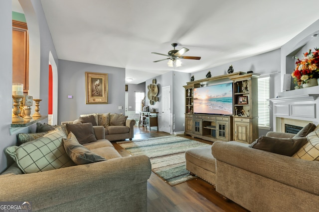 living room with hardwood / wood-style floors and ceiling fan