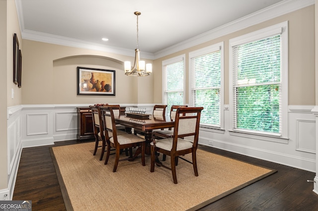 dining space with crown molding, a notable chandelier, and dark hardwood / wood-style flooring