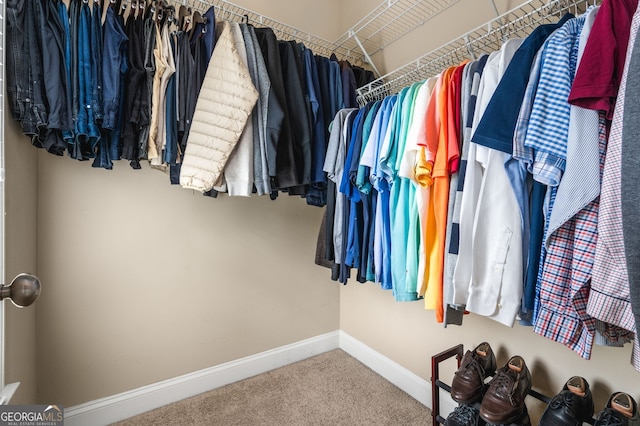 walk in closet featuring carpet