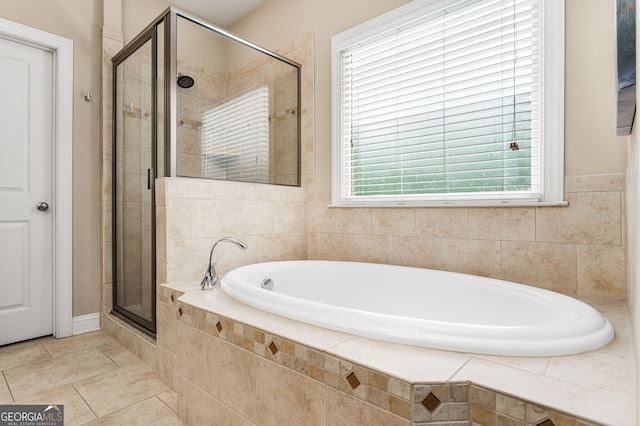 bathroom featuring tile patterned flooring and plus walk in shower