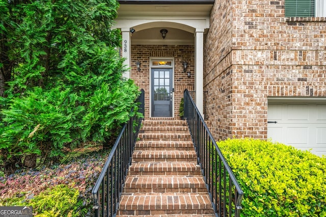 entrance to property featuring a garage