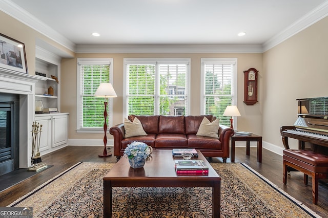 living room with built in features, dark hardwood / wood-style flooring, and crown molding