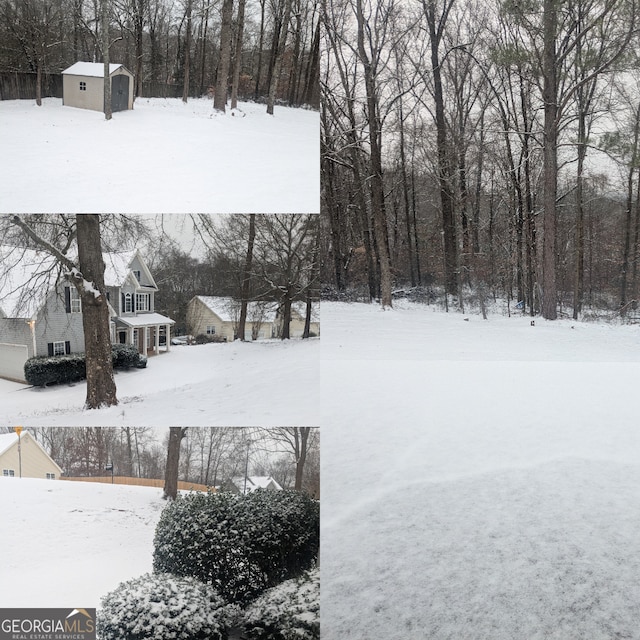 yard layered in snow featuring an outbuilding