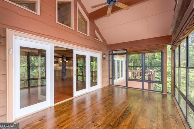 unfurnished sunroom with french doors, lofted ceiling with beams, and ceiling fan