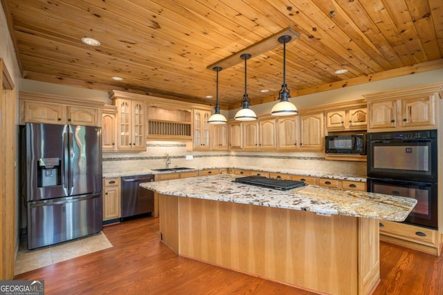 kitchen with black appliances, a kitchen island, light stone counters, and dark wood-type flooring