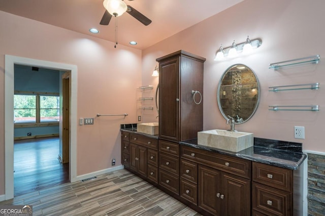 bathroom with ceiling fan, hardwood / wood-style floors, and vanity