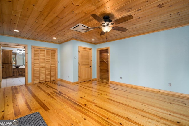 unfurnished bedroom featuring connected bathroom, ceiling fan, light hardwood / wood-style flooring, and wood ceiling