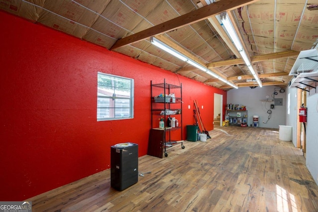 misc room with beamed ceiling, wood-type flooring, and wooden ceiling