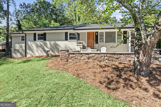 ranch-style home featuring a shingled roof, crawl space, brick siding, and a front lawn