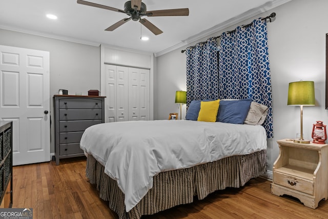 bedroom with ornamental molding, recessed lighting, a closet, and wood finished floors