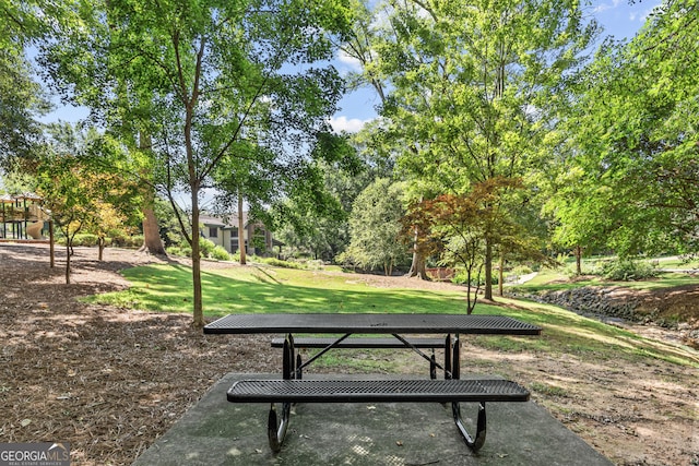 view of home's community with a lawn