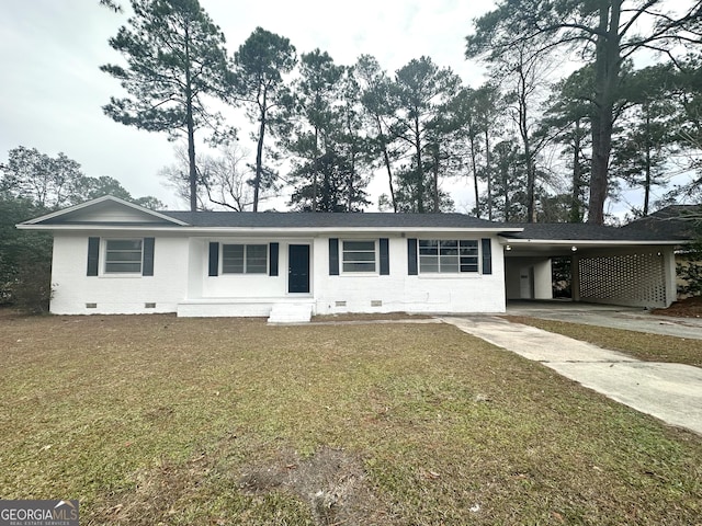 ranch-style home with brick siding, a carport, a front yard, crawl space, and driveway