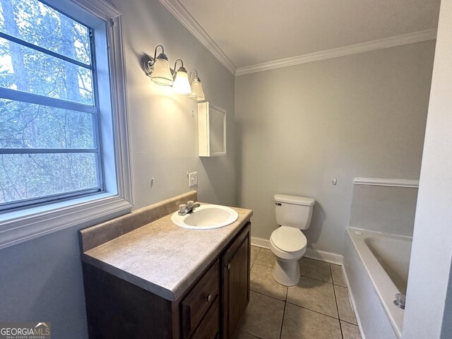 bathroom featuring vanity, a tub to relax in, ornamental molding, tile patterned floors, and toilet