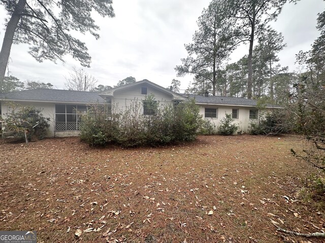 view of front facade featuring a sunroom