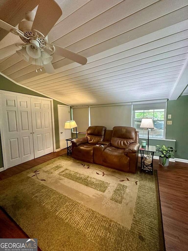 living room featuring ceiling fan, lofted ceiling, and hardwood / wood-style floors