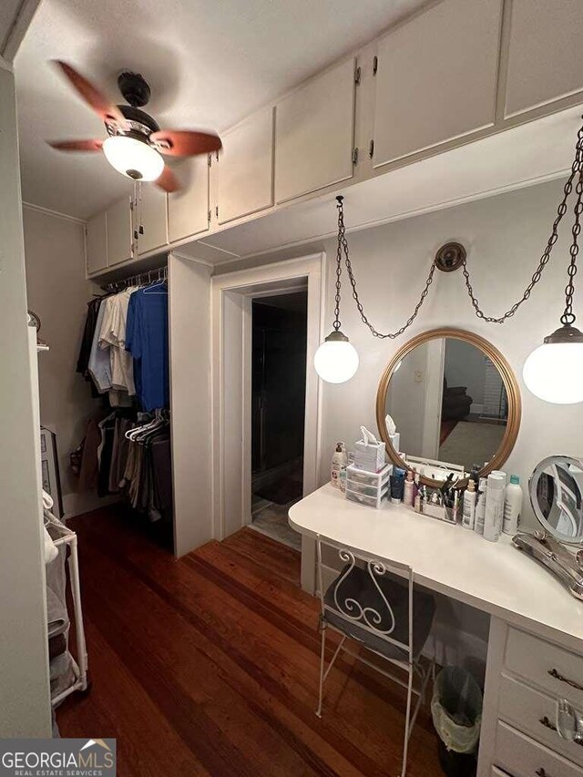 bathroom with ceiling fan, hardwood / wood-style flooring, and vanity