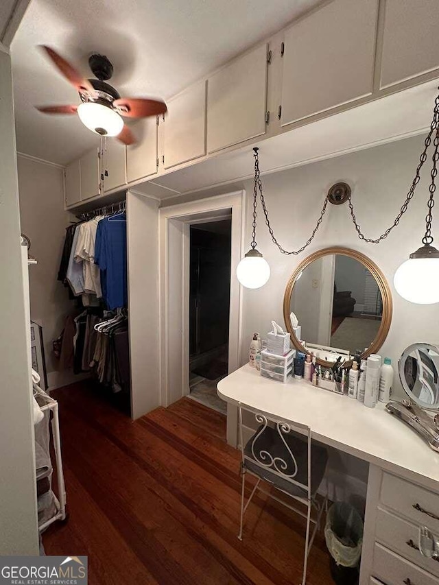 bathroom featuring a ceiling fan and wood finished floors