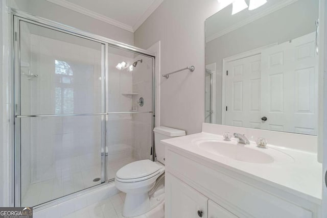 bathroom featuring toilet, vanity, and a shower with shower door