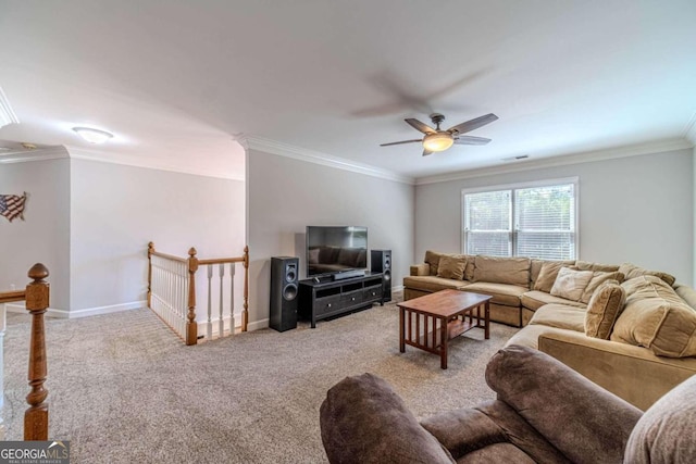 carpeted living room featuring ceiling fan and crown molding