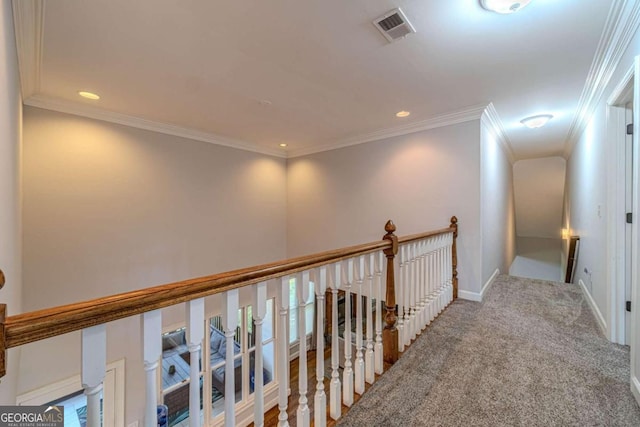 corridor featuring carpet floors and crown molding