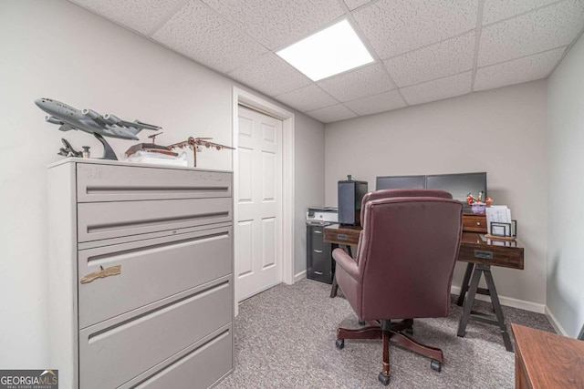 office with a drop ceiling and light colored carpet