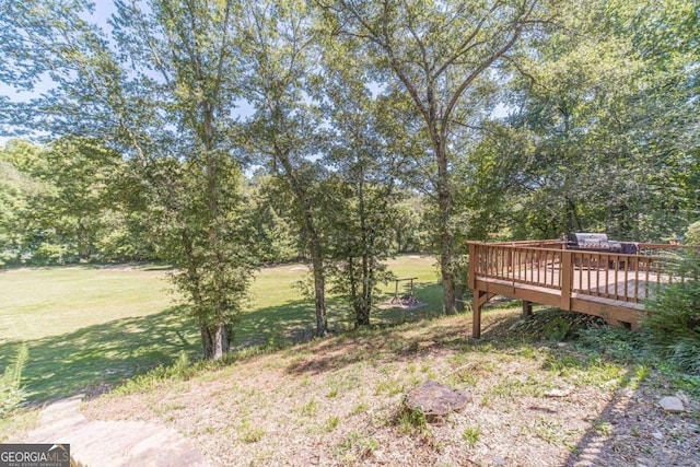 view of yard with a wooden deck