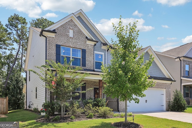 craftsman inspired home featuring a front yard and a garage