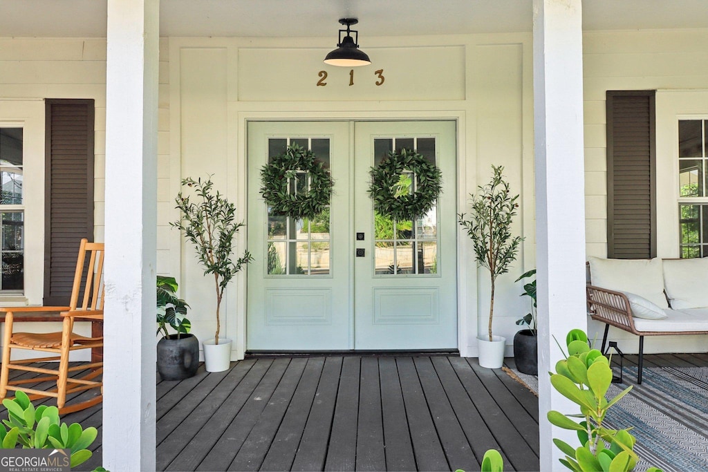 entrance to property featuring french doors