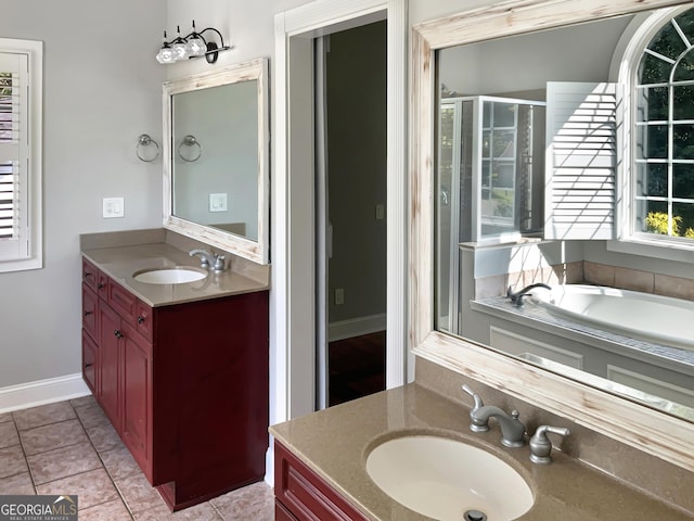 full bathroom with two vanities, a sink, tile patterned flooring, and a shower stall