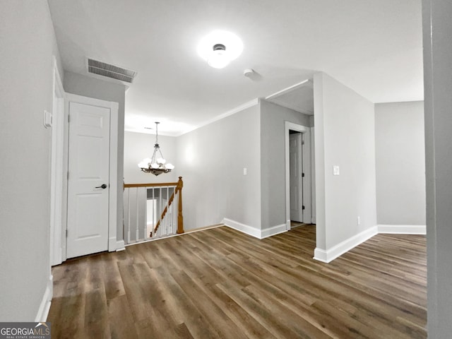 305 Crest Pointe S, Bremen, GA 30110 - empty room featuring baseboards, wood finished floors, a chandelier, and ornamental molding
