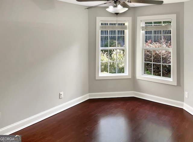 unfurnished dining area featuring ceiling fan, wood finished floors, and baseboards