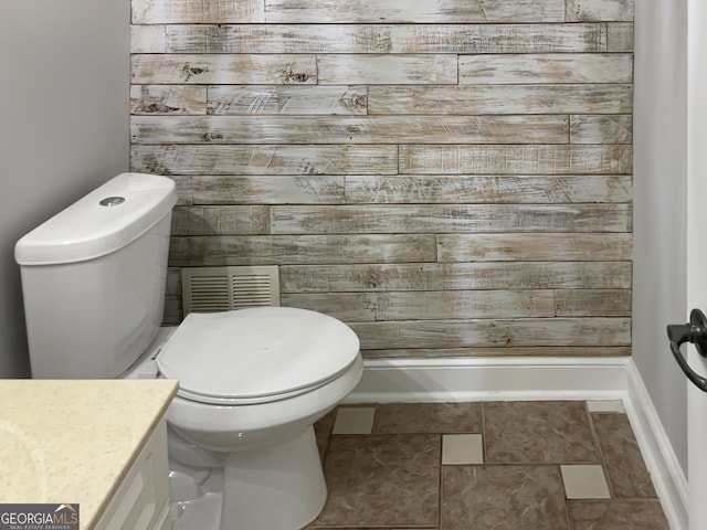 bathroom with visible vents, vanity, and toilet