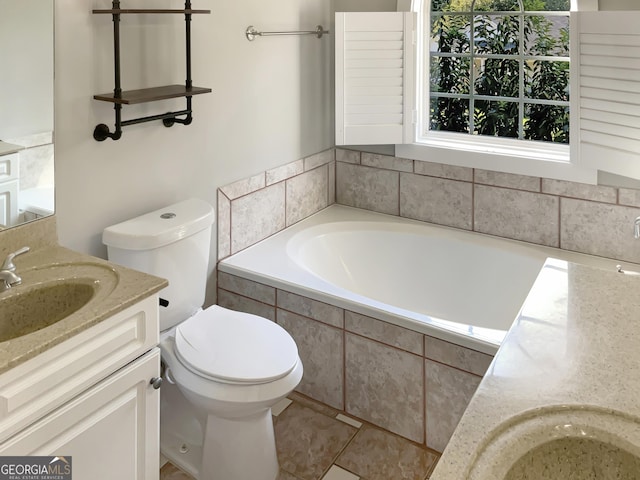 full bathroom with toilet, vanity, and a bath