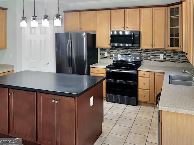 kitchen featuring a center island, pendant lighting, appliances with stainless steel finishes, glass insert cabinets, and a sink