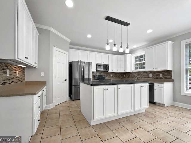 305 Crest Pointe S, Bremen, GA 30110 - kitchen featuring appliances with stainless steel finishes, tasteful backsplash, dark countertops, crown molding, and white cabinets